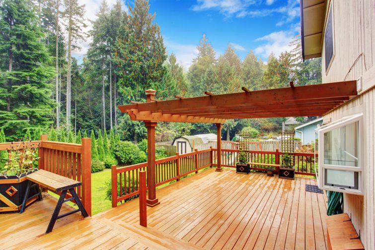 A deck with picnic furniture.