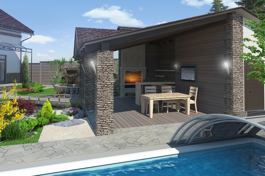 A garden oasis featuring a pool and barbecue grill.