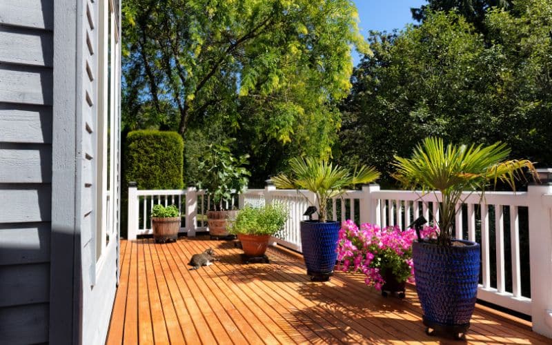 A deck design featuring potted plants.
