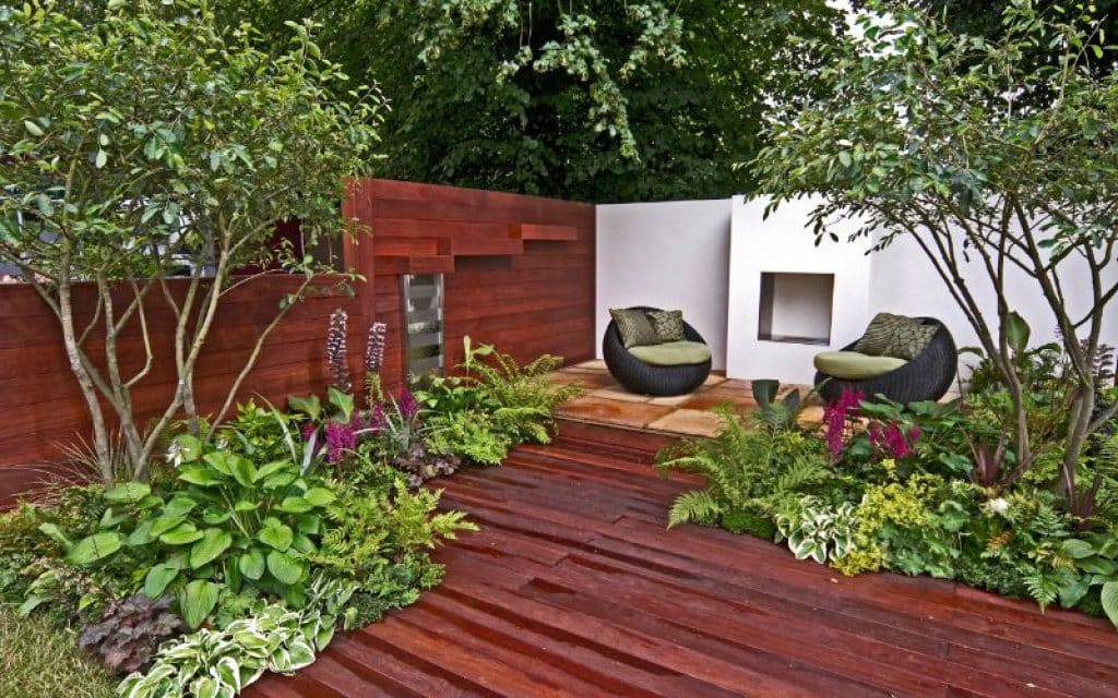 a modern show garden with seating and decking for an urban garden