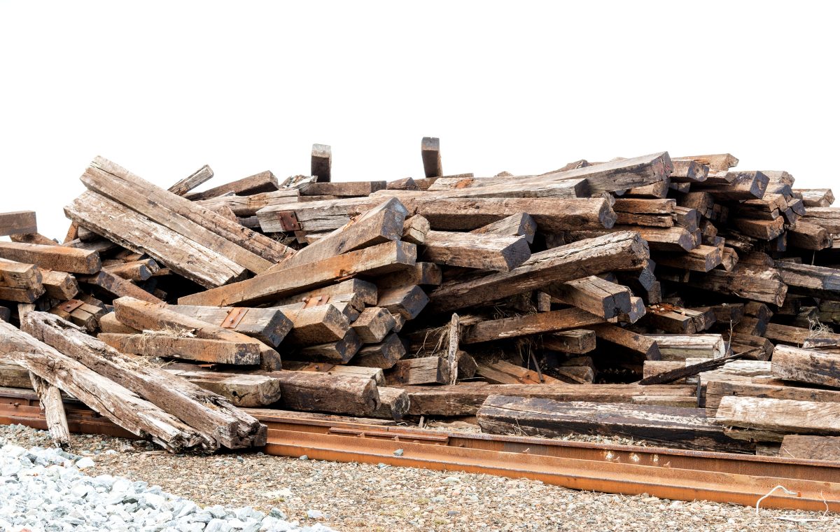 A pile of wood on a train track.