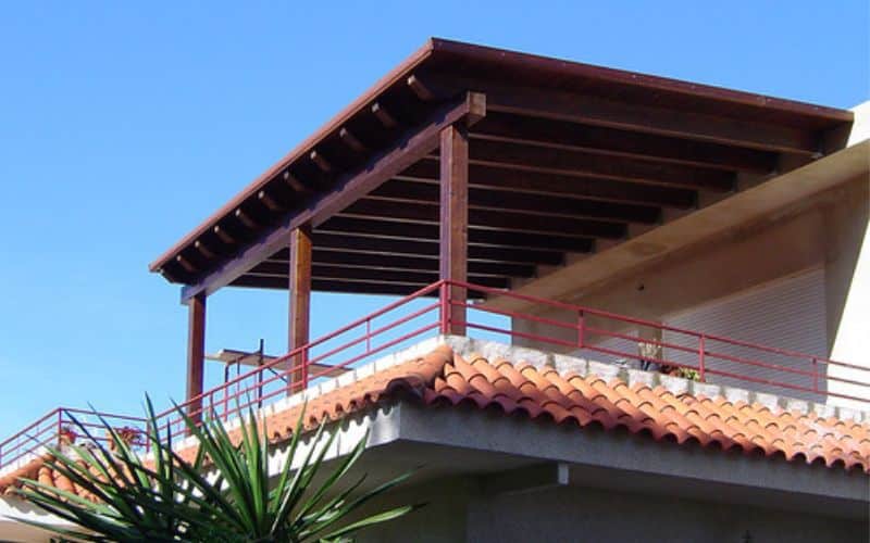 An attached pergola with waterproof roof