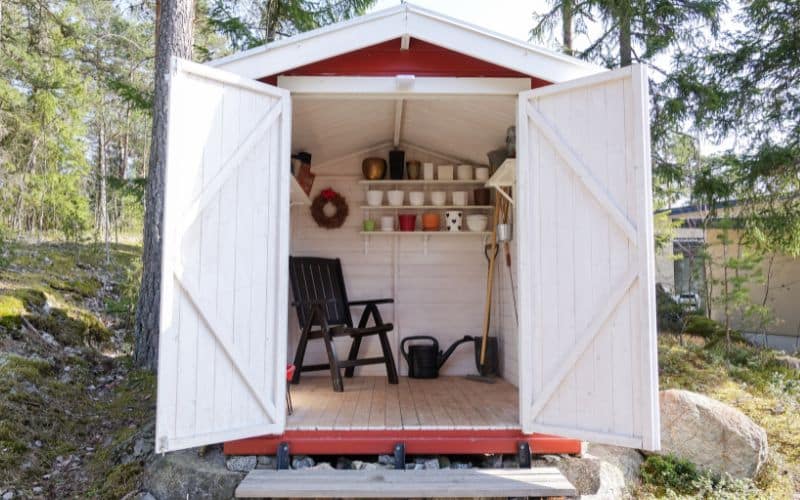A red and white garden shed.