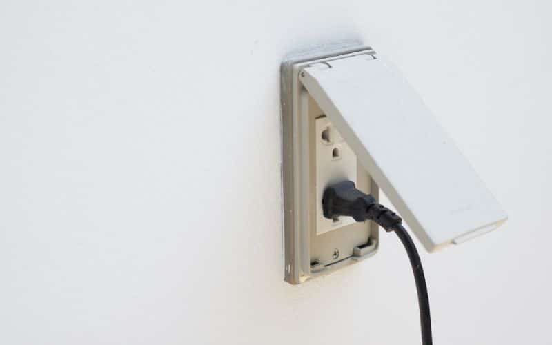 Weatherproof outdoor plug covers protecting against rain and harsh weather