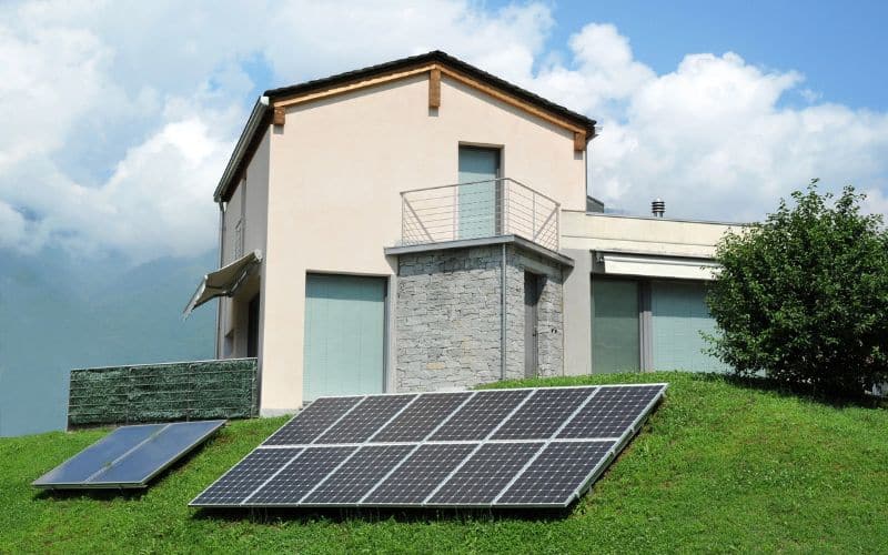 Solar panels installed in a garden, capturing sunlight for energy efficiency